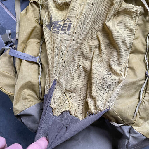 Before - Torn mesh panel on backpack. Before - Torn mesh panel on backpack.
